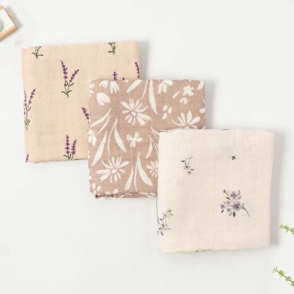 Three bamboo muslin cloths in lavender, daisy and lilac floral prints, folded, set of 3, 60x60cm